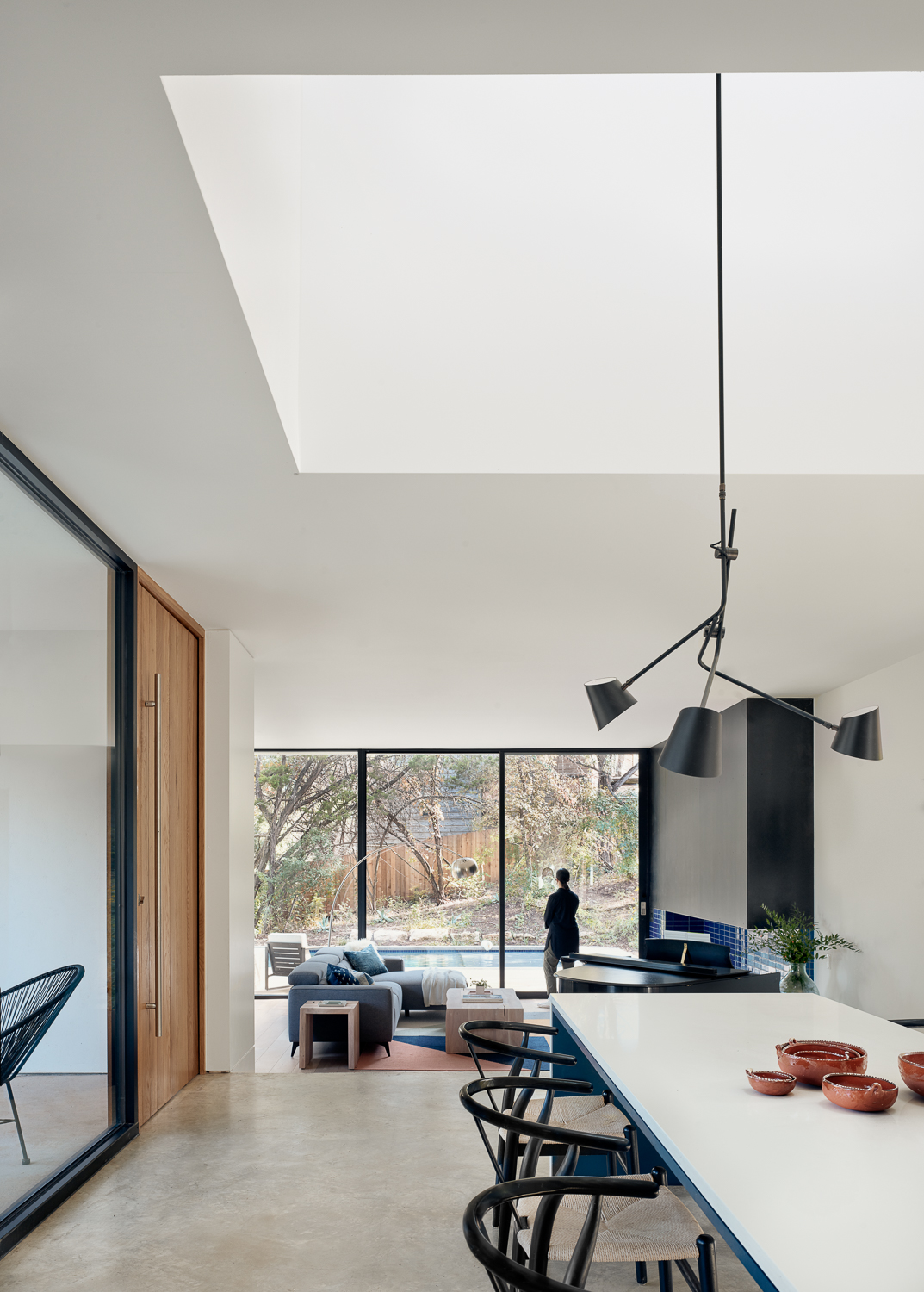 Kitchen area with large skylight in Alterstudio-designed house in Austin